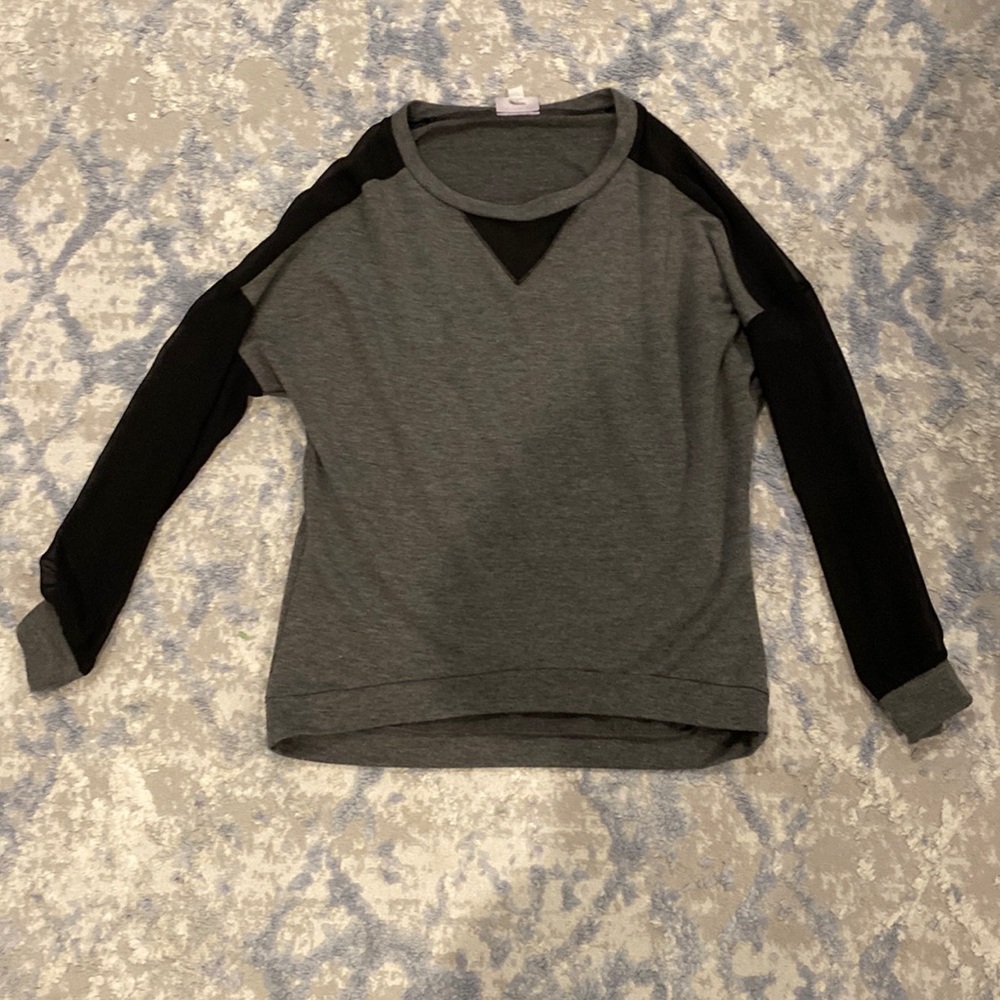 Women long sleeved top with sheer sleeves